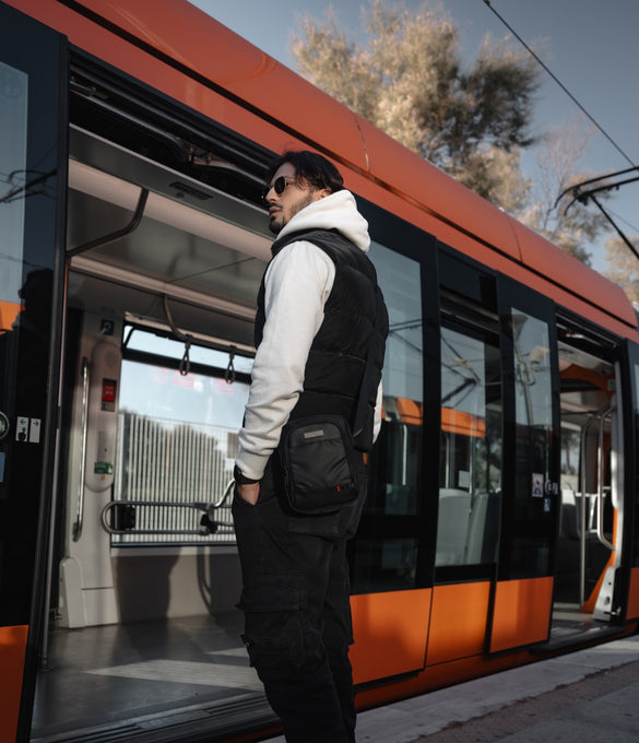 a man standing on the side of a train 